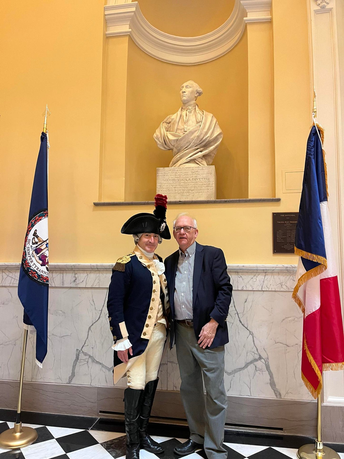 Photograph of Bruce E. Mowday with Lafayette on Lafayette Day in front of Houdon's Lafayette in the Richmond Capitol.