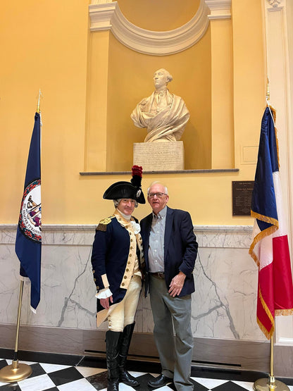 Photograph of Bruce E. Mowday with Lafayette on Lafayette Day in front of Houdon's Lafayette in the Richmond Capitol.  